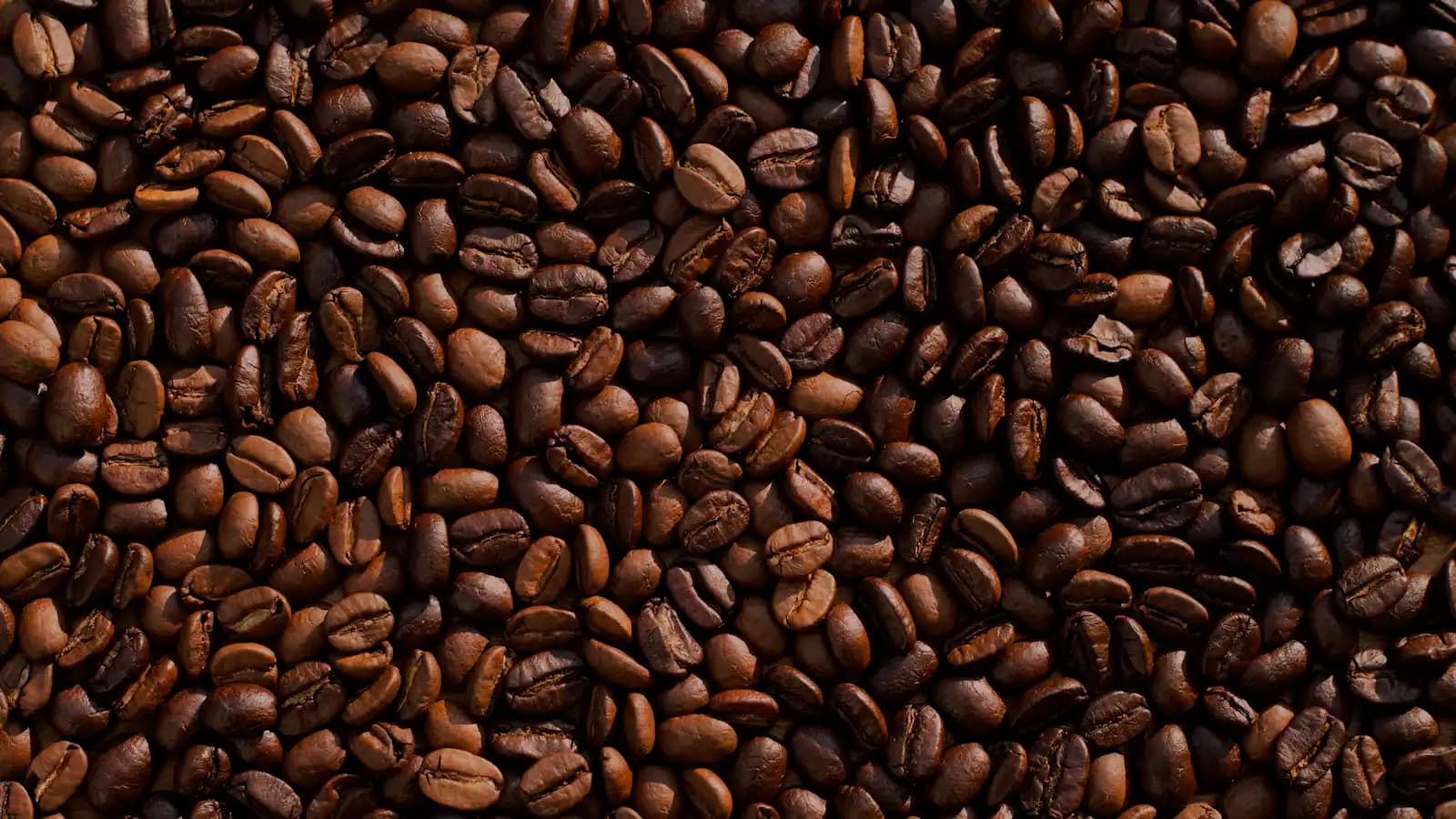 Small cups of Cuban espresso on a counter at a pavement coffee window